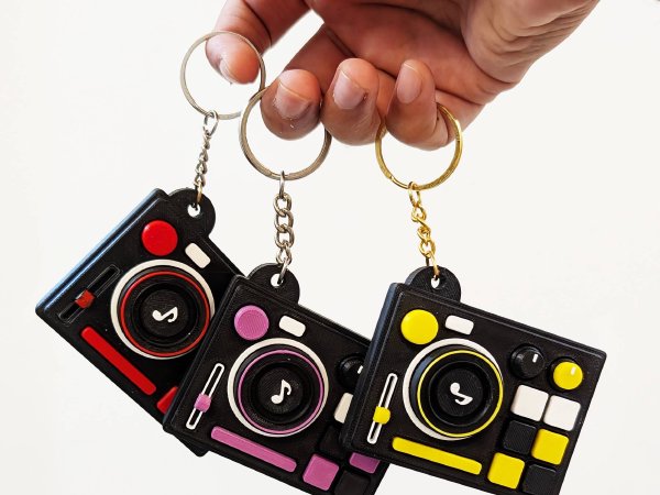 Keychains Held in Hand for Scale